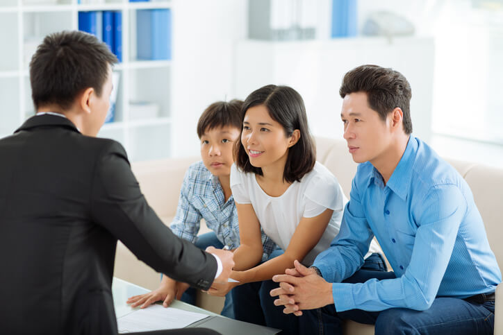 A financial advisor counsels a family on financial matters