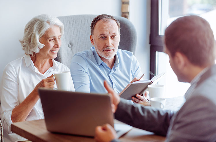 Elderly Couple meeting with financial business professional