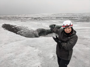 Lori, bundled up and showing off the Icelandic glacier