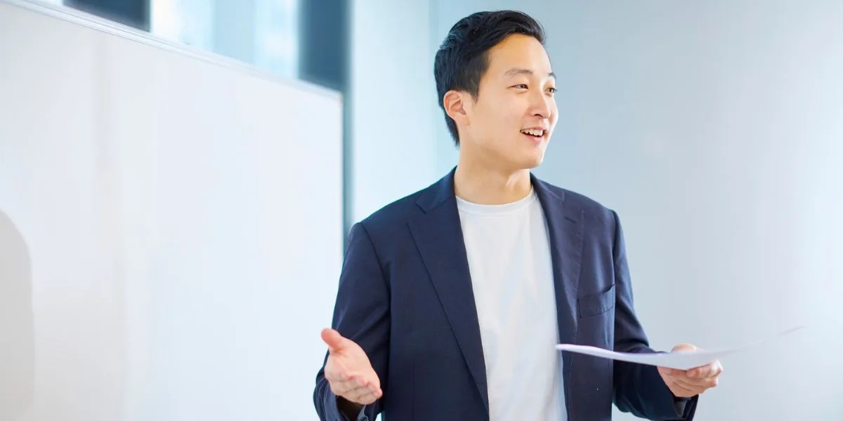 Medical professional speaks to his audience at an in-person seminar