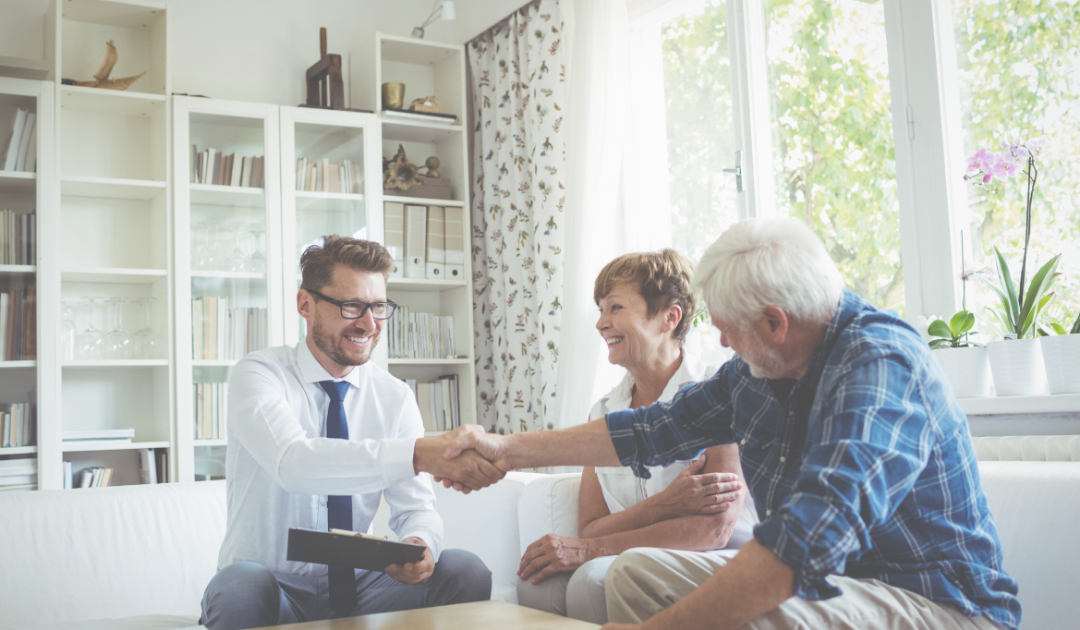 financial advisor having a meeting with an elderly couple