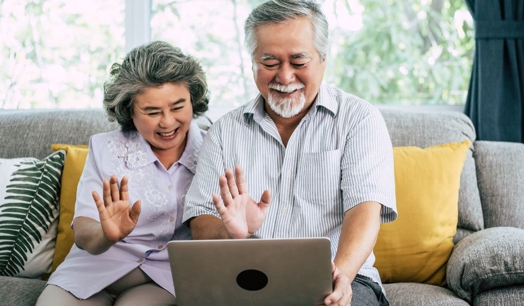 Eldery Asian couple on a computer video call