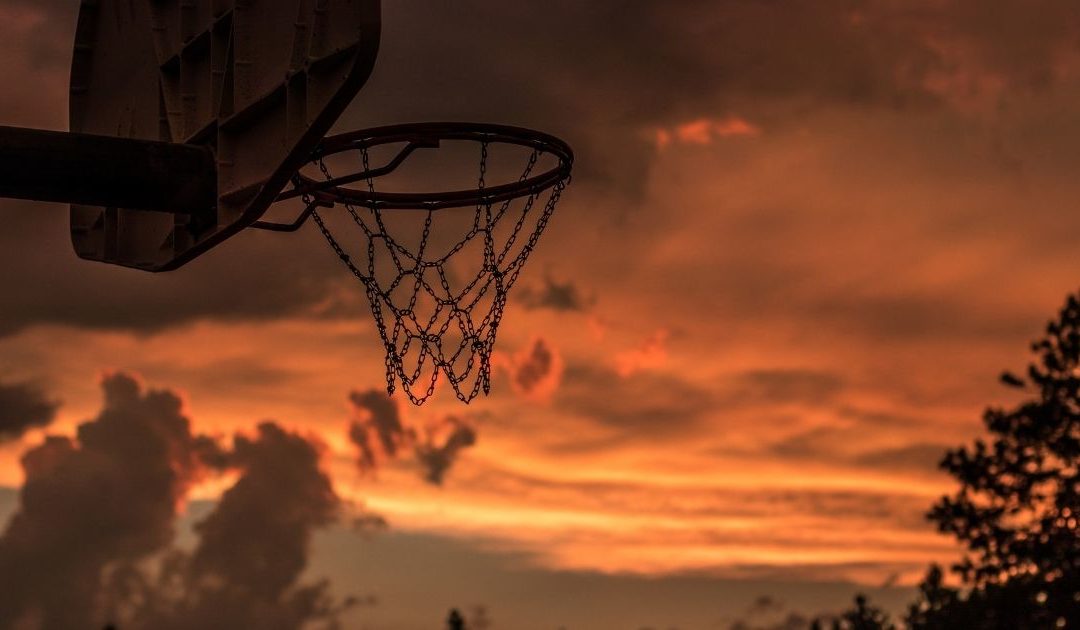 Sunset behind a basketball net