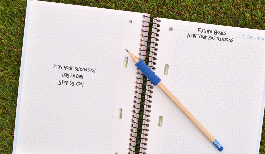 Open notebook with pen, ready to jot down New Year's Resolutions