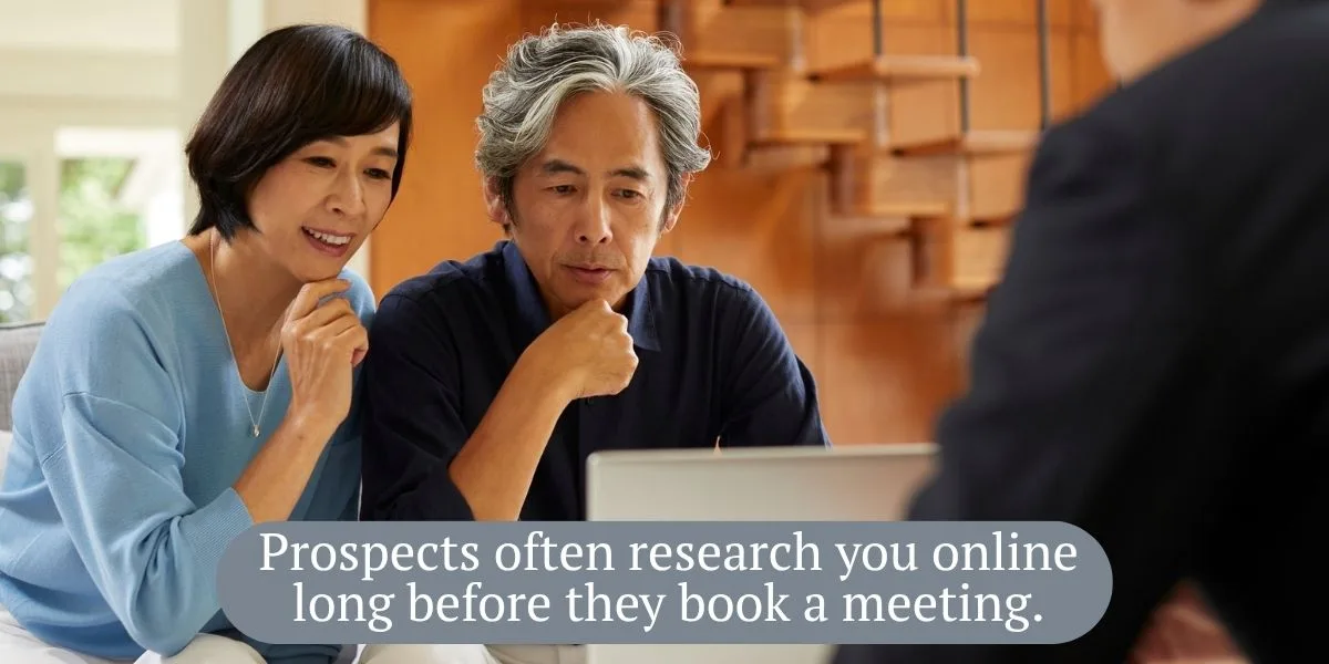 Pre-retiree couple researching a financial advisor’s website on a laptop at home