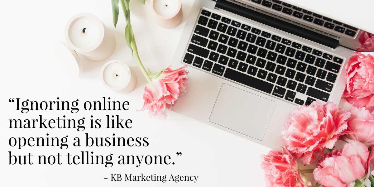Open laotop, white candles, and a bouquet of pink carnations sit on top of a white table. Copy to the left says, "Ignoring online marketing is like opening a business but not telling anyone."