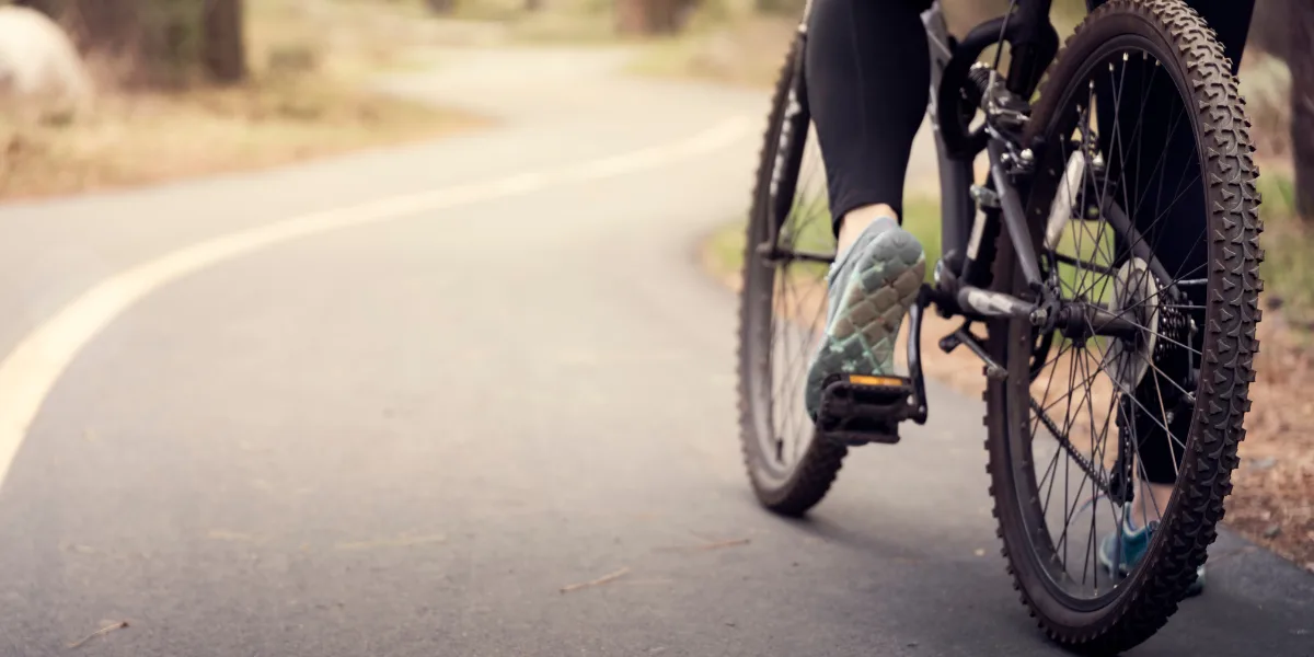 Woman riding a bike on the road
