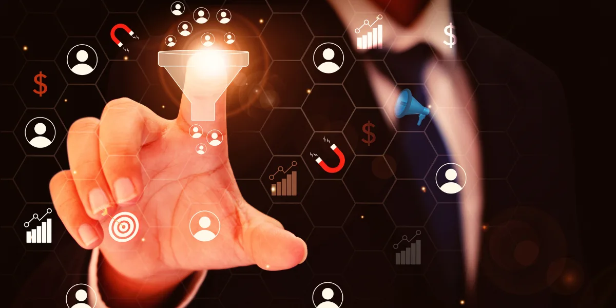 Professional man's hand highlighting the sales funnel, and other marketing items