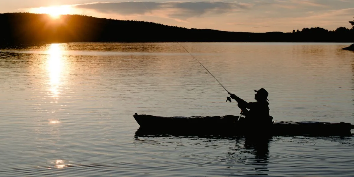 Man in a kayak, fishing