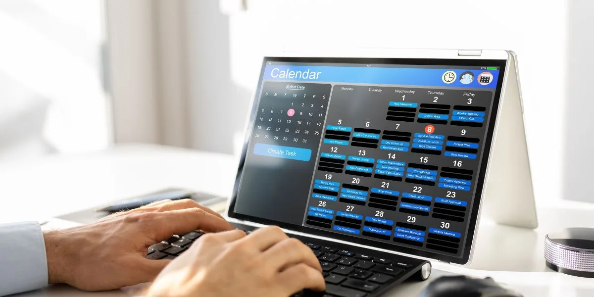 Full calendar appears on a laptop screen Full calendar appears on a laptop screen