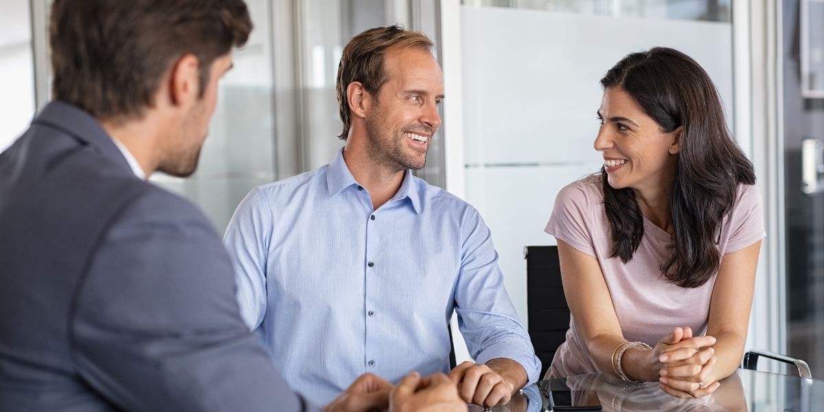 Couple meeting with estate planning attorney to discuss planning.