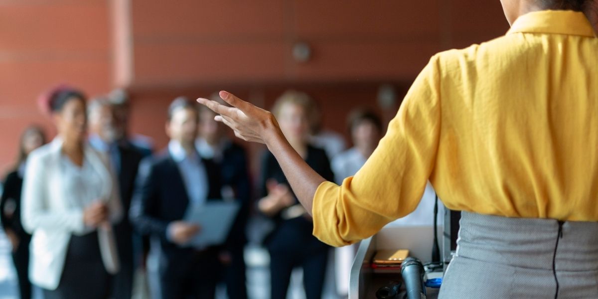 Business professional presenting educational workshop to small group
